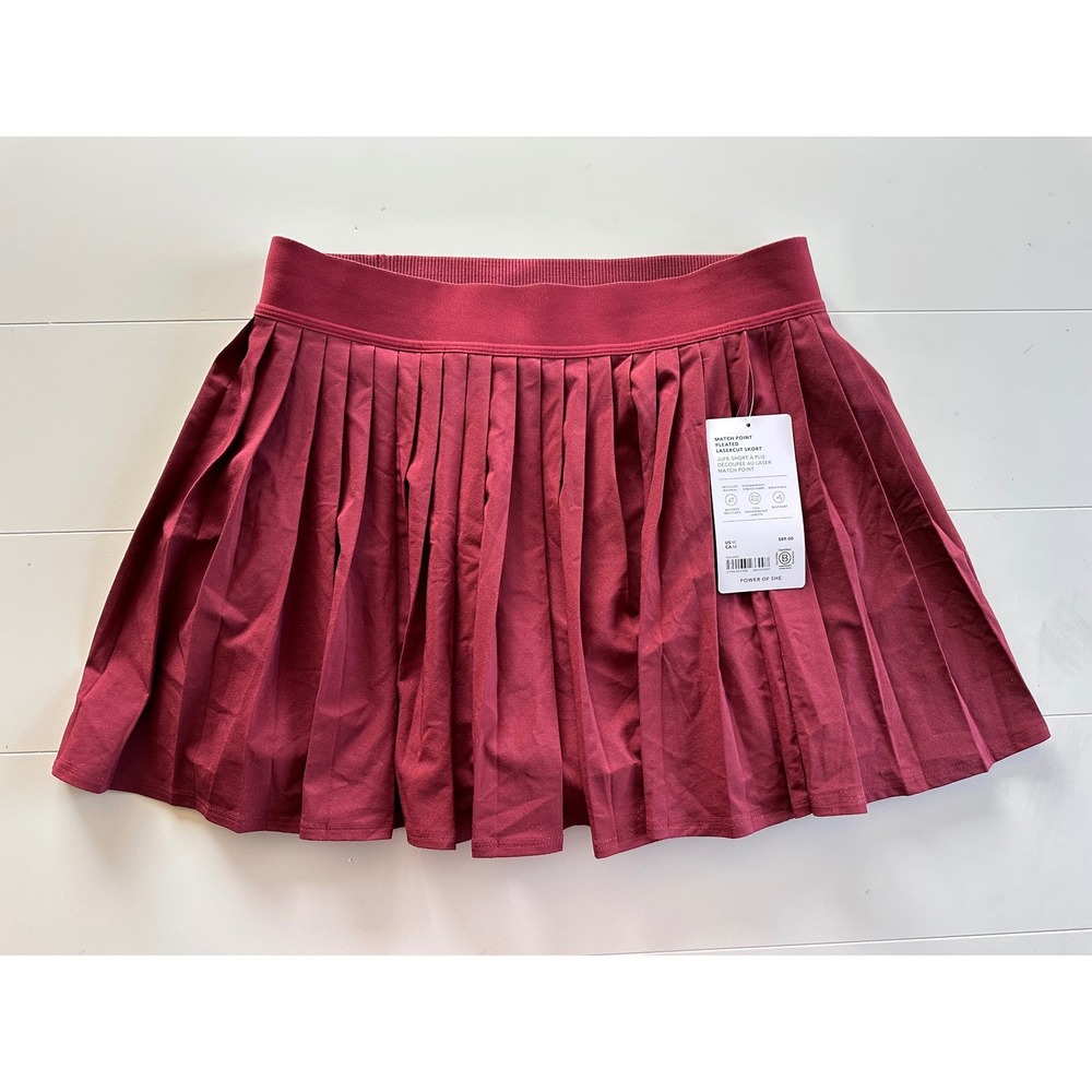 Athleta Match Point Pleated Lasercut Skort Burgundy Red Tennis Womens M NEW